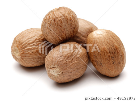Group of whole nutmeg isolated on white Group of whole nutmeg isolated on white 49152972