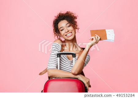 Time to travel. Woman with tickets looking at camera 49153284