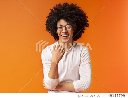 Cute Carefree Black Curly Guy Laughing On Stock Photo