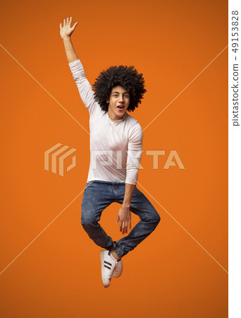 Funny young black man jumping on the air - Stock Photo [49153828] - PIXTA