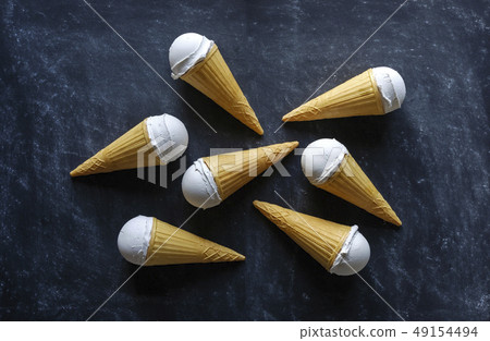 Six tasty refreshing vanilla ice cream cones 49154494