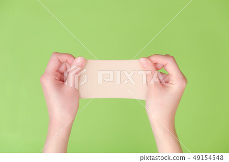Stock Photo: hand holding a pill Stock Photo: hand holding a pill 49154548