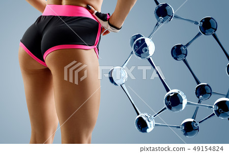 Athletic woman standing near white molecule chain. 49154824
