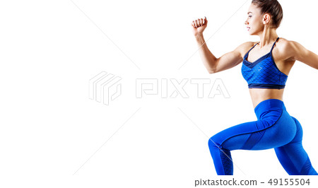 Young woman runner in blue sportswear jump in the air. 49155504