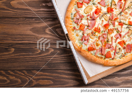 Delicious pizza with ham 49157756