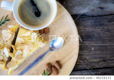 Cake and coffee cup on tray. Cake and coffee cup on tray. 49158131