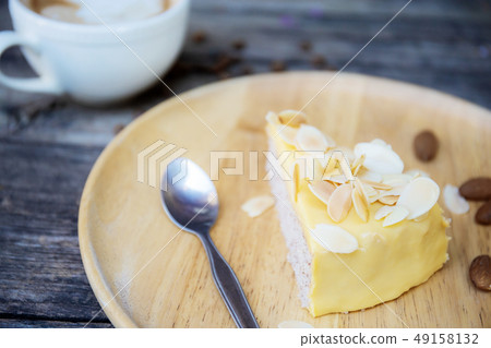 Cake and coffee cup on table. 49158132