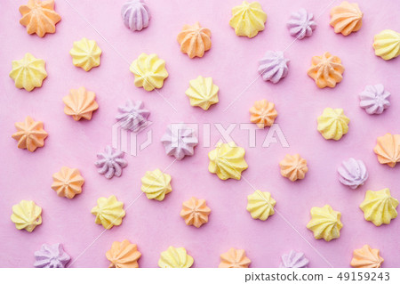 meringues on pastel pink background, food template 49159243
