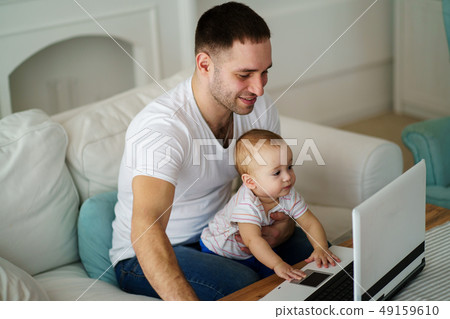 Father and son watching video or playing game 49159610