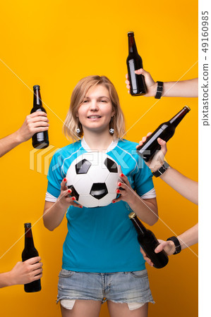 Image of sports blonde with arms choosing between ball and bottle of alcohol Image of sports blonde with arms choosing between ball and bottle of alcohol 49160985
