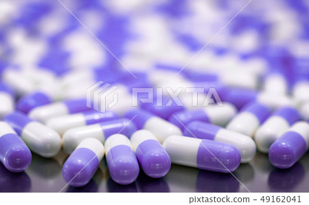Selective focus purple and white capsule pills  49162041