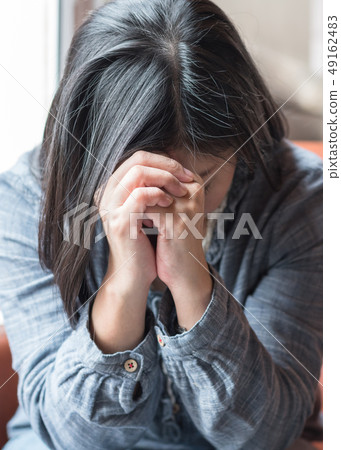 Woman praying for christianity holy spirit belief 49162483