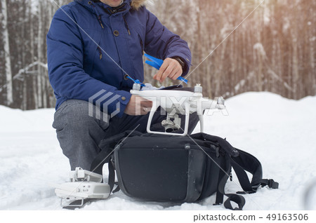 Man preparing for starting with drone. Man preparing for starting with drone. 49163506