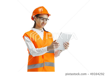 The female builder in orange helmet isolated on white 49164292