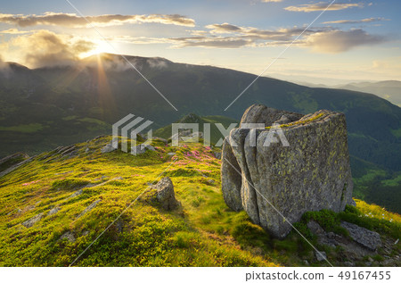 Sun setting behind the mountain Sun setting behind the mountain 49167455