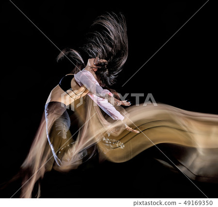 young woman modern dancer dancing isolated black background light painting young woman modern dancer dancing isolated black background light painting 49169350