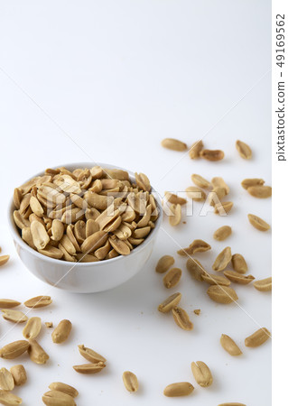 Roasted peanuts and salt in a bowl Roasted peanuts and salt in a bowl 49169562