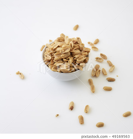 Roasted peanuts and salt in a bowl Roasted peanuts and salt in a bowl 49169563