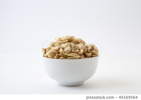Roasted peanuts and salt in a bowl Roasted peanuts and salt in a bowl 49169564