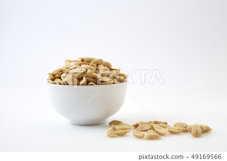 Roasted peanuts and salt in a bowl Roasted peanuts and salt in a bowl 49169566