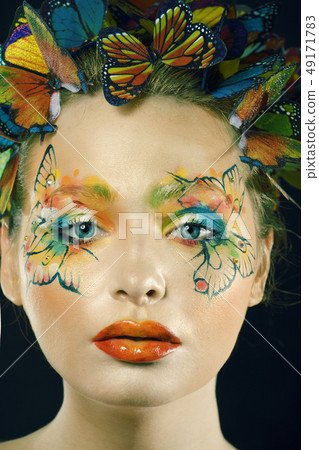 woman with summer creative make up like fairy butterfly closeup bright colored background woman with summer creative make up like fairy butterfly closeup bright colored background 49171783