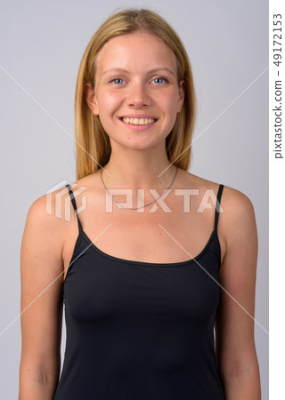Face of happy young beautiful blonde woman smiling 49172153