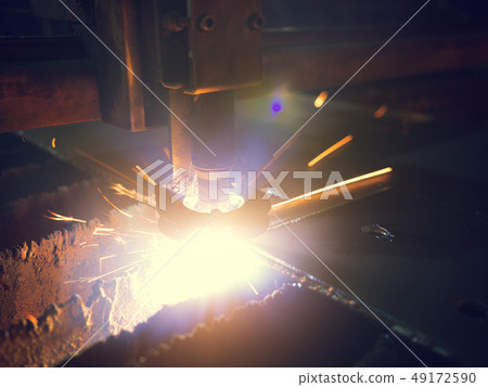 Close-up Laser Cutting Machine Cuts A Sheet Of Metal Close-up Laser Cutting Machine Cuts A Sheet Of Metal 49172590