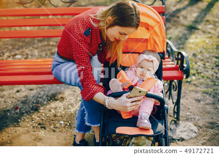 stylish mother with little daughter 49172721