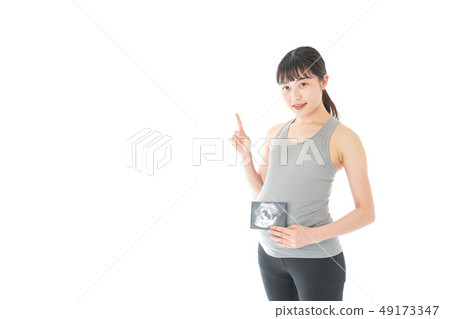Pregnant woman doing exercise 49173347