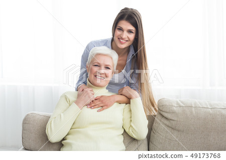 Love you, mom. Young woman hugging mature mother 49173768