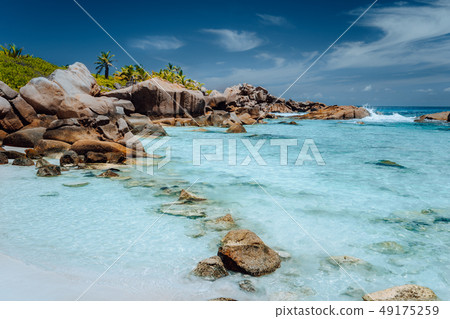 Low tide on paradise beach Anse Cocos on La Digue, Seychelles. Vacation background Low tide on paradise beach Anse Cocos on La Digue, Seychelles. Vacation background 49175259