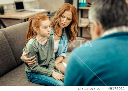 Sad nice young girl suffering from autism 49176011
