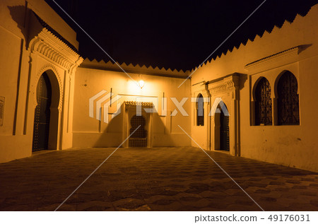Illuminated Night streets of Asilah Medina, on Atlantic Coast in Morocco Illuminated Night streets of Asilah Medina, on Atlantic Coast in Morocco 49176031