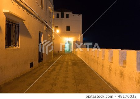 Illuminated Night streets of Asilah Medina, on Atlantic Coast in Morocco Illuminated Night streets of Asilah Medina, on Atlantic Coast in Morocco 49176032