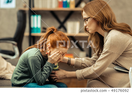 Pretty red haired girl showing her emotions 49176092