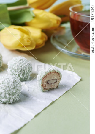 coconut candies and cup of tea coconut candies and cup of tea 49176345