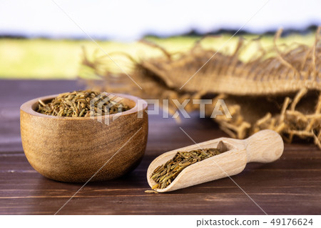 Roman caraway cumin with field behind 49176624