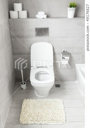 White ceramic bidet and toilet at luxury bathroom White ceramic bidet and toilet at luxury bathroom 49176827