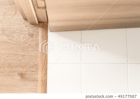 Room indoors. Hinge, jamb and plinth near doorway Room indoors. Hinge, jamb and plinth near doorway 49177087