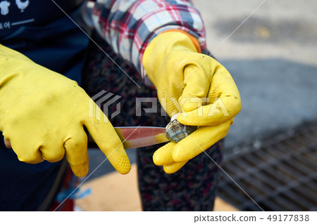Man hands clasped with gloves 49177838