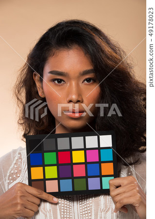 Asian Woman after applying make up hair style Asian Woman after applying make up hair style 49178023