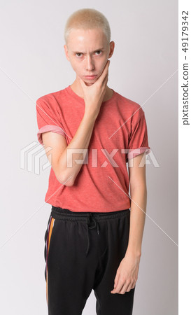 Portrait of young handsome androgynous man thinking 49179342