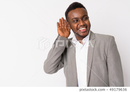 Portrait of happy young African businessman thinking and listening 49179636