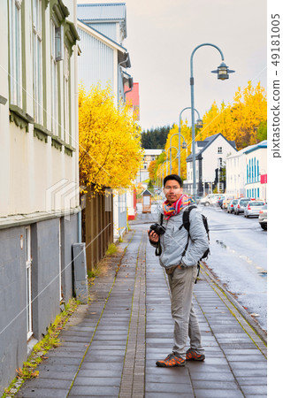 A man traveler sight seeing downtown Akureyri A man traveler sight seeing downtown Akureyri 49181005