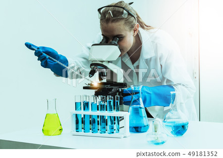 Woman scientist working in chemist laboratory. Woman scientist working in chemist laboratory. 49181352