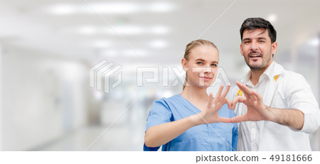 Doctors at hospital working with another doctor. Doctors at hospital working with another doctor. 49181666