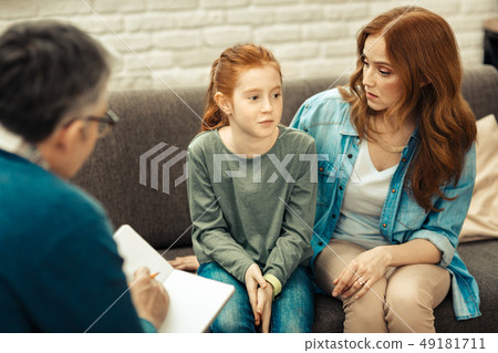 Nice young woman looking at her daughter 49181711