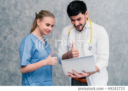 Doctor and nurse working with laptop computer. 49181715