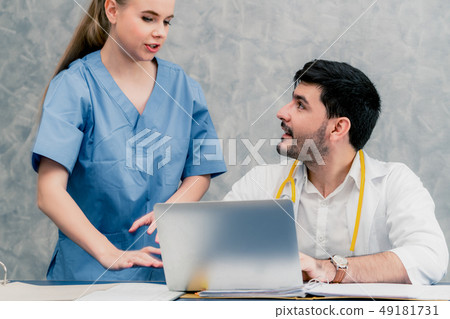 Doctor and nurse working with laptop computer. 49181731
