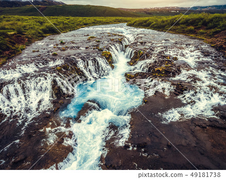 Bruarfoss waterfall in Brekkuskogur, Iceland. Bruarfoss waterfall in Brekkuskogur, Iceland. 49181738